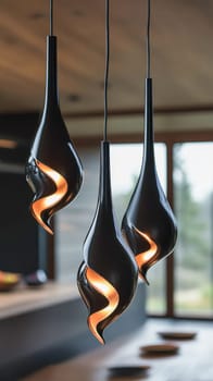 Three modern black pendant lamps illuminating a contemporary interior design space