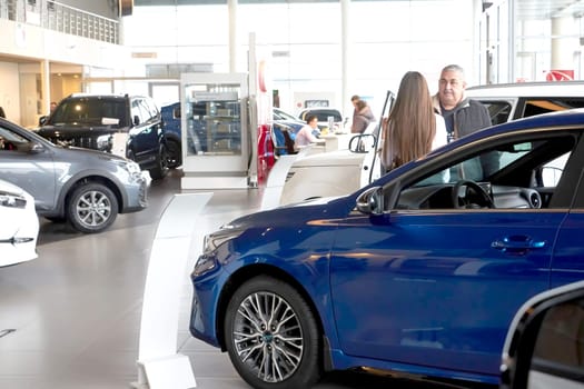 Kazan, Russia - November 25, 2022: Cars in showroom of dealership Kia in Kazan in Russia. Partial focus