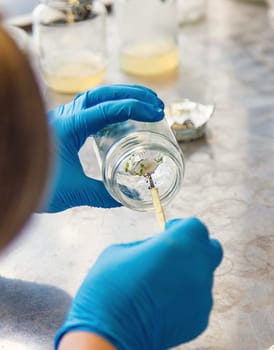 laboratory jars with plants. Selective focus. People.