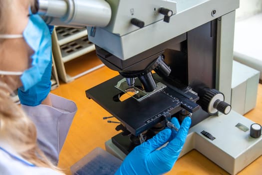 Examine in the laboratory under a microscope. Selective focus. medicine.