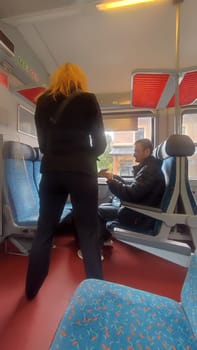October 21 2024 Lazne Belohrad Czech Republic Europe, travel train station ,woman in a train carriage, people, transport. High quality photo