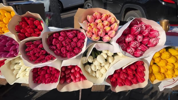 Selling bouquets of tulips on the city street