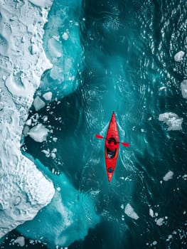 A red kayak floating on the electric blue water, surrounded by marine organisms and possibly fish fins underwater. A picturesque view of aqua fluidity in marine biology