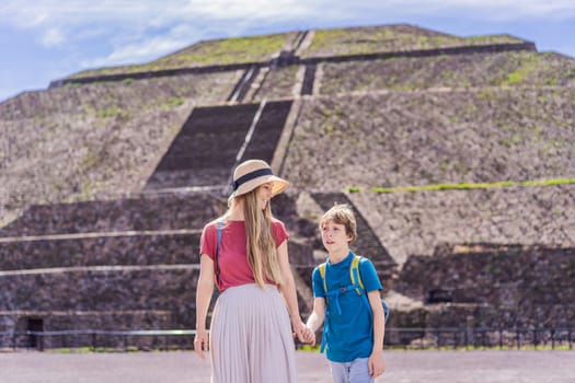 Mother and son tourists exploring Teotihuacan, Mexico. Cultural heritage, ancient ruins, and archaeological adventure concept.
