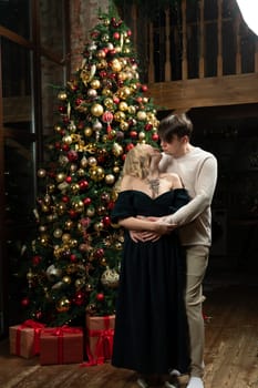 celebration christmas smiling joy family winter tree december decoration man woman happiness