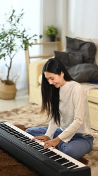 Female musician enjoying her music practice in cozy living room.