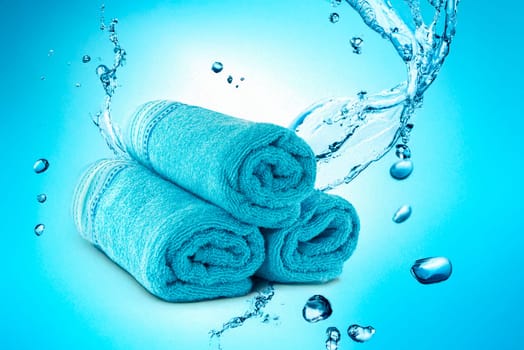 three rolled sauna towels isolated on white background