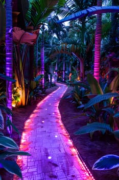 The walkway through the jungle is illuminated by purple lights, casting a magenta hue on the terrestrial plants and vegetation. The vibrant colors create a surreal atmosphere in the darkness