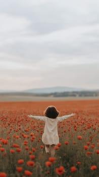 A young child with open arms in a vast field of poppies, capturing a sense of freedom and joy.