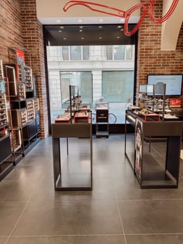 Cremona, Lombardy, Italy October 15th 2024 Modern and stylish interior of ray ban brand store, displaying various sunglasses and accessories on sleek shelves
