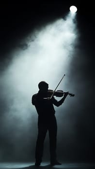 Silhouette of a violinist playing under a dramatic spotlight, creating an artistic and moody atmosphere.