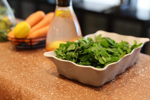 In a stylish modern kitchen, you can find bright and fresh herbs paired with colorful vibrant vegetables