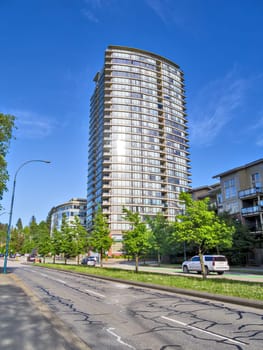 Street view with residential high-rise and low-rise buildings in Port Moody, BC.