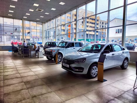 Kirov, Russia - April 27, 2023: Car in showroom of dealership Avtovaz, Lada in Russia. Russian car in big showroom