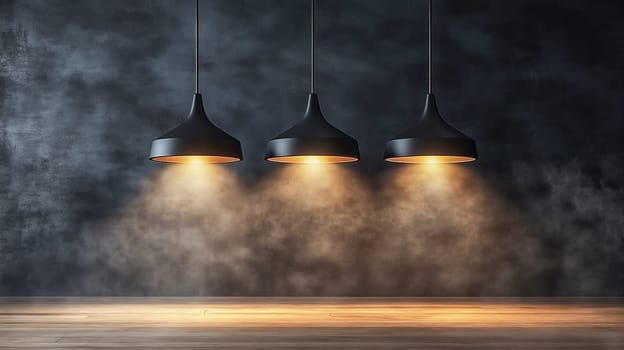 Three modern black lamps hanging from ceiling illuminating concrete wall in empty room