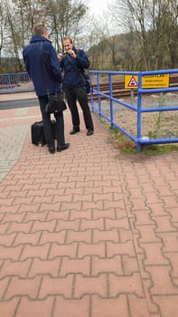 October 21 2024 Stara Paka, Czech Republic, two men in jackets talking on the street. High quality photo
