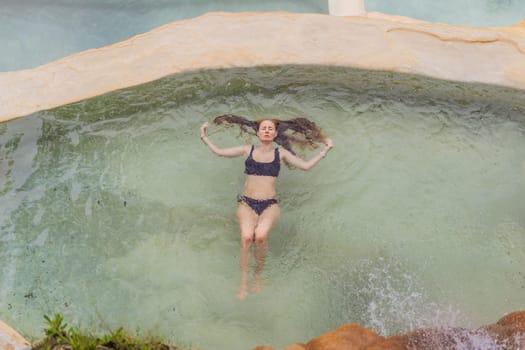 Female tourist at the hot springs of Grutas Tolantongo, Mexico. Adventure, relaxation, and natural wellness concept.