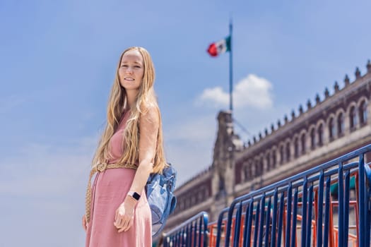 Female tourist in the central square of Mexico City, Zocalo. Cultural exploration, travel, and historic architecture concept.
