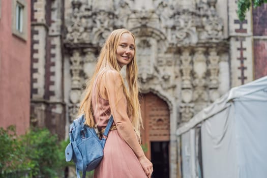 Female tourist in the central square of Mexico City, Zocalo. Cultural exploration, travel, and historic architecture concept.
