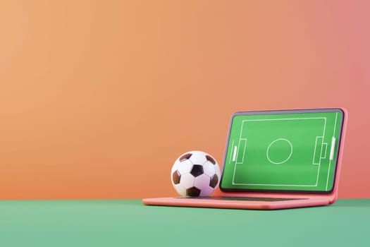 laptop displaying soccer field with ball nearby, symbolizing sports.