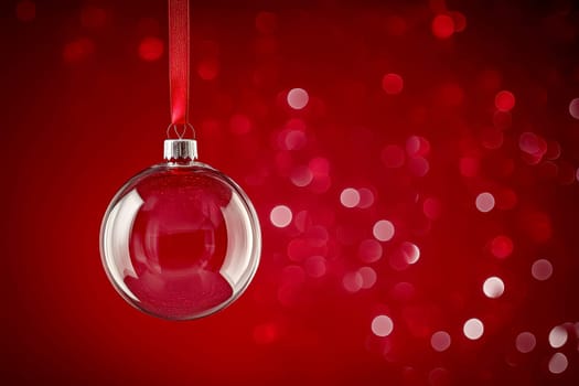 transparent glass Christmas bauble hanging on a red ribbon with space for text on a bokeh Christmas red isolated background --ar 3:2 --v 6.1 Job ID: 72add5f0-0fb0-4085-bf56-dda5cd5383af