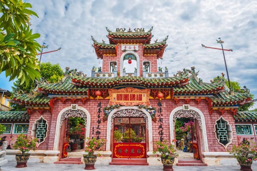 Beautiful Asian gate to the Hoi Quan Phu Kien Buddhist pagoda with a temple in the old town in Hoi An in Vietnam in Asia