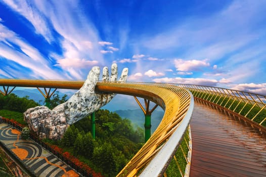 Golden Bridge of the Hand of Gods at the Sun World Ba Na Hills amusement Park in Da Nang in Vietnam in summer