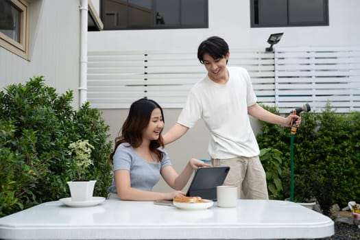 Beautiful couple enjoying leisure time in the backyard.