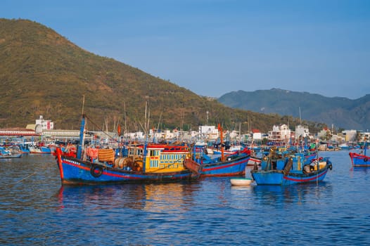 Traditional Vietnamese fishing boats and ships in the bay on the river at the Vinh Truong fishing port in Nha Trang. Nha Trang, Vietnam - September 8, 2024