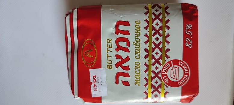 November 5 2024 Beer-Sheva city Israel, grocery store, butter in package, object Ukraine brand, Vinnitsa, food, Hebrew text. High quality photo