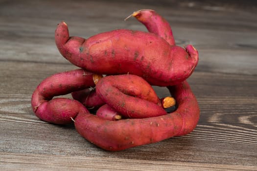 Sweet potatoes on the brown background, High quality photo