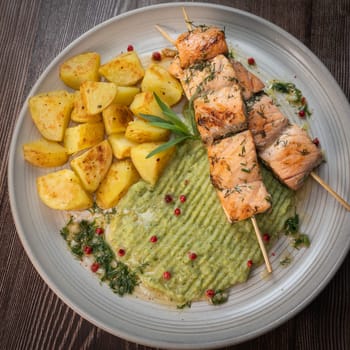 Barbecued salmon skewer with potatoes and broccoli Puree, High quality photo