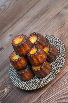 Caneles de bordeaux, traditional French sweet dessert with white table background, High quality photo
