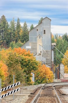 Railroad tracks lead to a vintage industrial building in Bonners Ferry, Idaho.