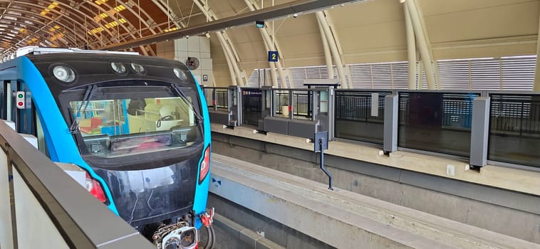 Light Rail Transit or LRT or rail transport system in Indonesia, modern metro train stationed at an urban platform, showcasing efficient public transport and contemporary infrastructure