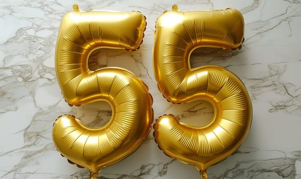 Golden congratulatory balloons in the shape of the number 55. Selective focus.