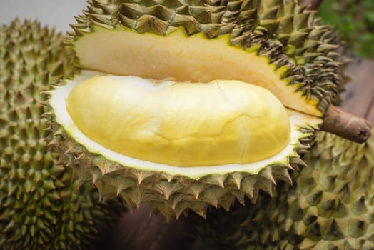 Mon Thong durian fruit on wooden plank background. Regarded by many people in southeast asia as the king of fruits.