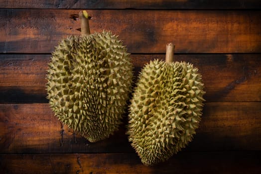 Mon Thong durian fruit on wooden plank background. Regarded by many people in southeast asia as the king of fruits.