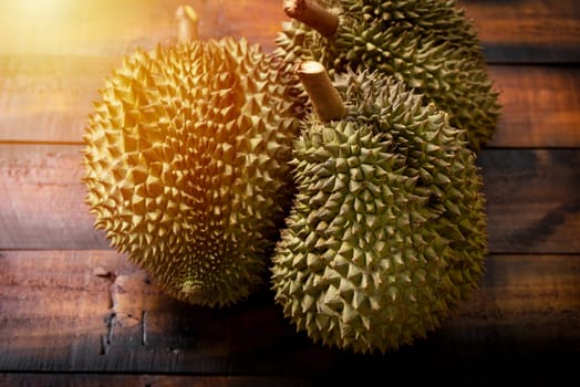 Mon Thong durian fruit on wooden plank background. Regarded by many people in southeast asia as the king of fruits.