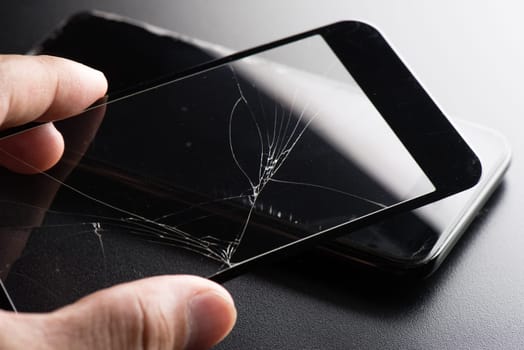 closeup broken tempered glass screen protector for smartphone.