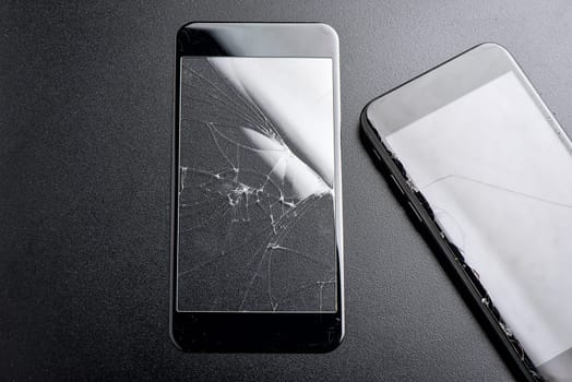 closeup broken tempered glass screen protector for smartphone.