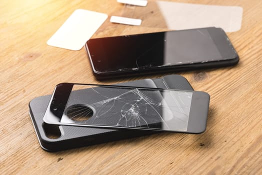 closeup broken tempered glass screen protector for smartphone.