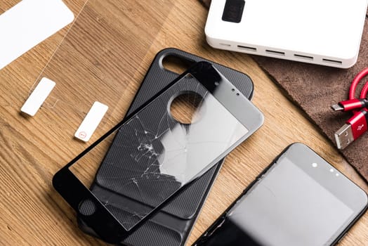 closeup broken tempered glass screen protector for smartphone.