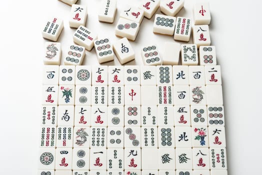 Many old mahjong tiles on white background. Mahjong is the ancient asian board game.