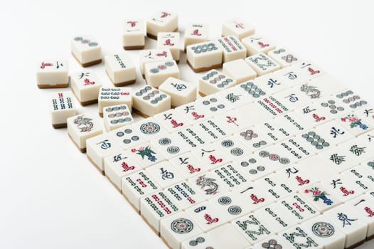 Many old mahjong tiles on white background. Mahjong is the ancient asian board game.