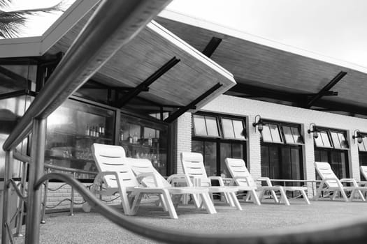 plastic beach chair at resort in black and white