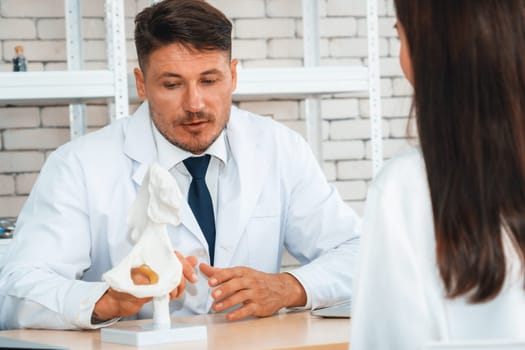 Doctor in professional uniform examining patient at hospital or medical clinic. Health care , medical and doctor staff service concept. Jivy