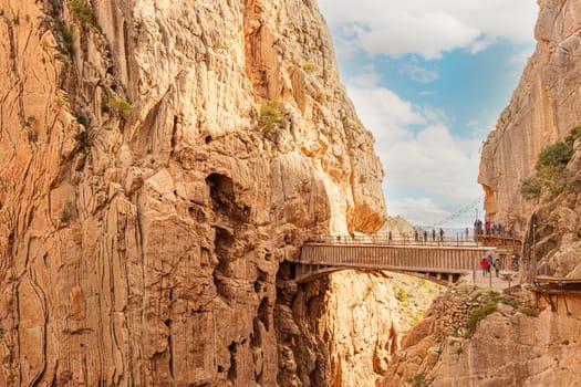 Hikers crossing the bridge of the Caminito del Rey gorge. General view