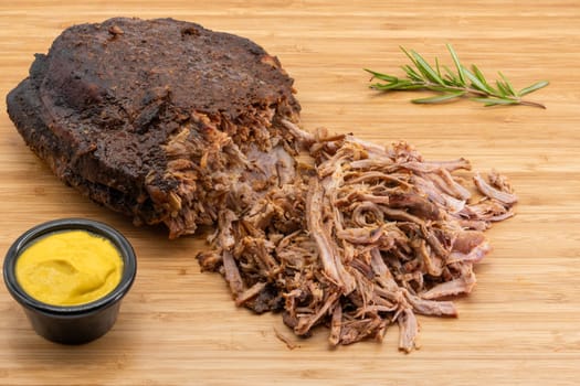 Enjoy pulled beef brisket with zesty mustard and fresh rosemary for an unforgettable taste experience