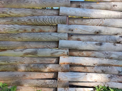 A series of aged wooden planks are arranged in a staggered pattern, providing a rustic texture and ample space for text or graphics.
